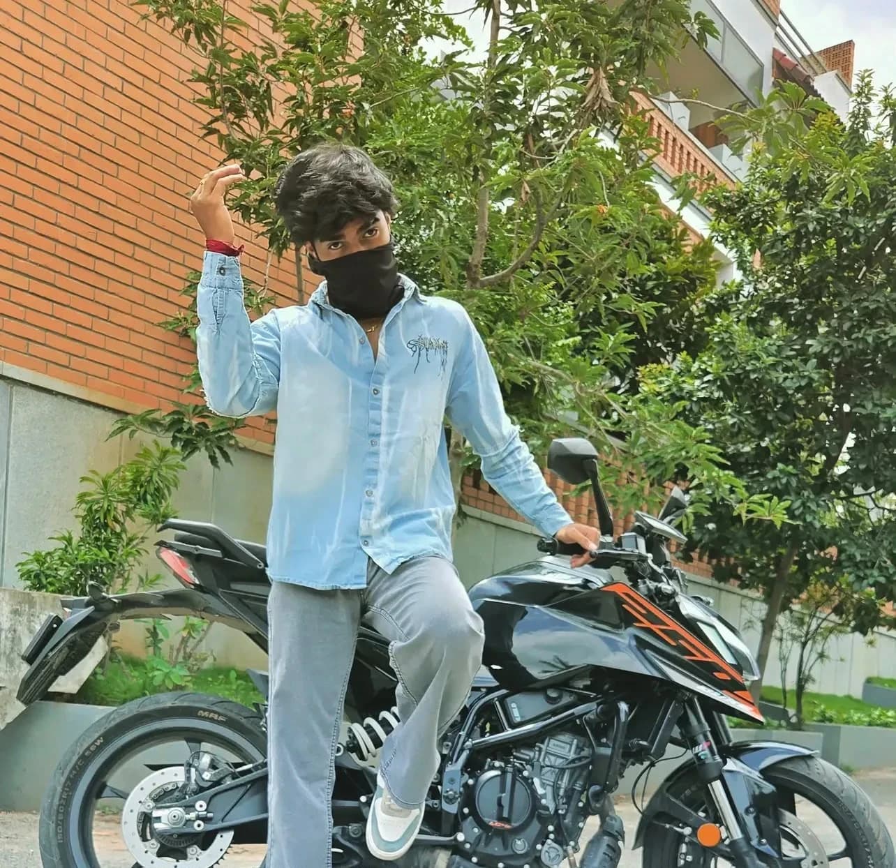 Rider posing on a KTM Duke
